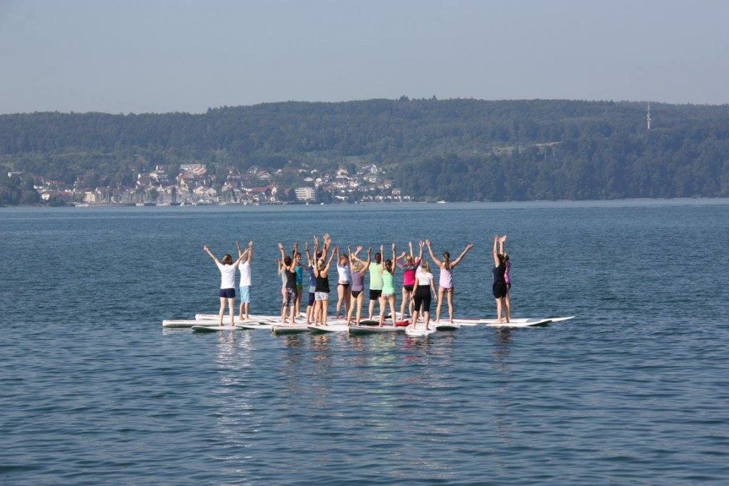 paddle board yoga with stand up paddle board